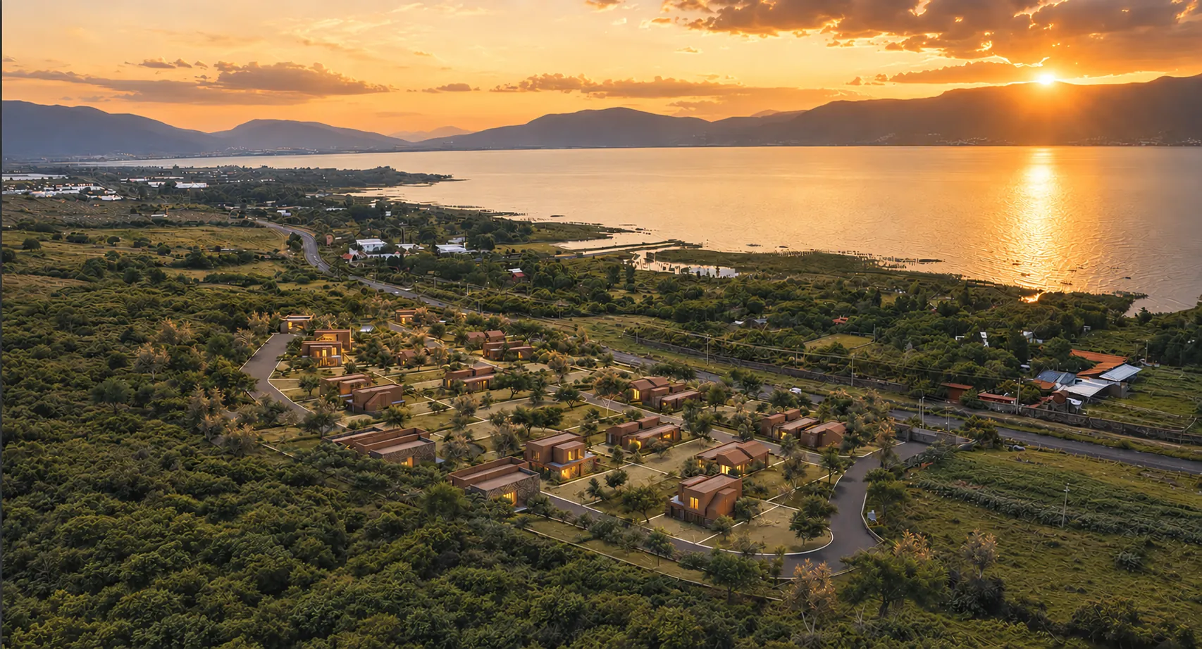 Aerial view of La Raya at sunset, with Lake Chapala and the mountains beyond