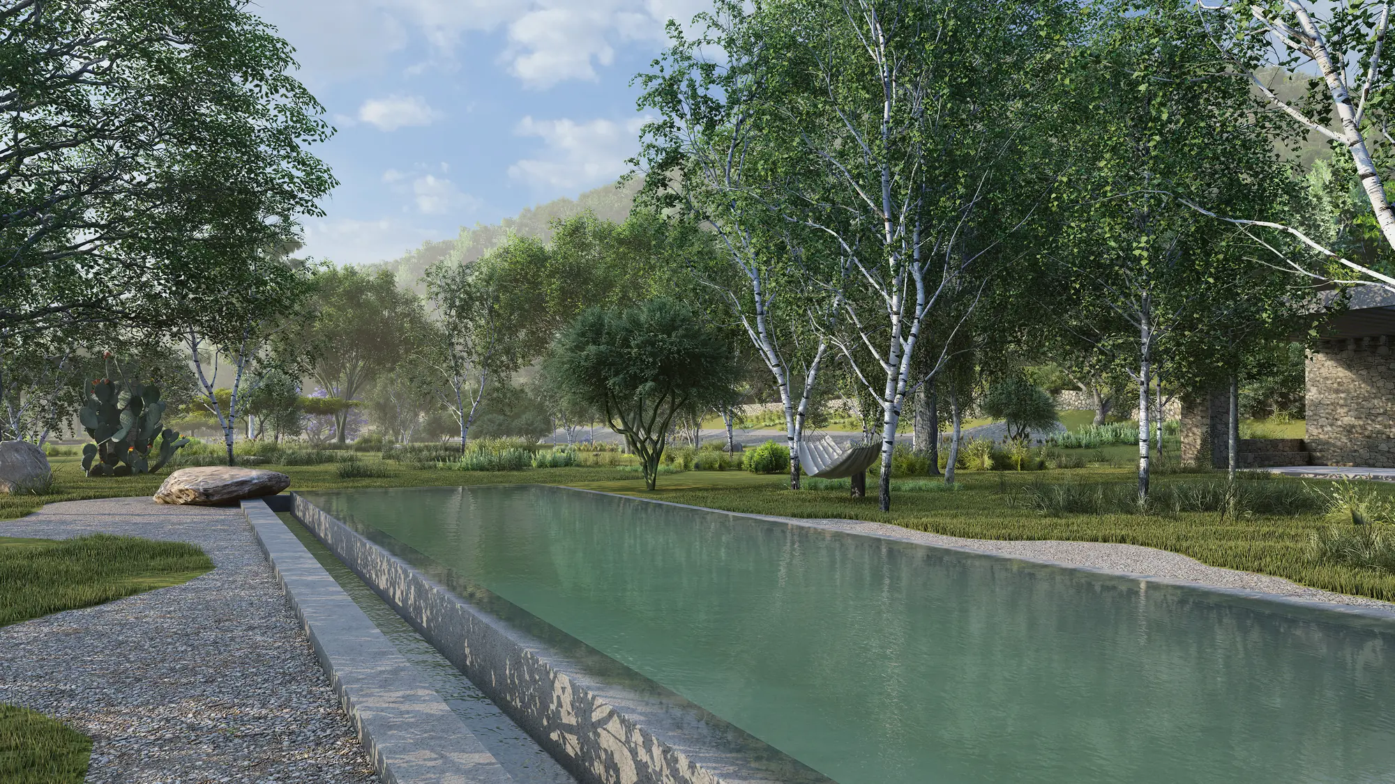 Long lap pool among birch trees and gravel paths